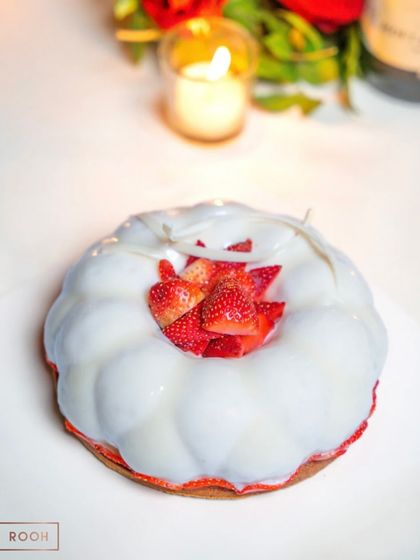 Our Strawberry Haven dessert, created especially for Valentine's Day. The glossy glaze and fresh strawberry topping make it an irresistible treat for the season of love.