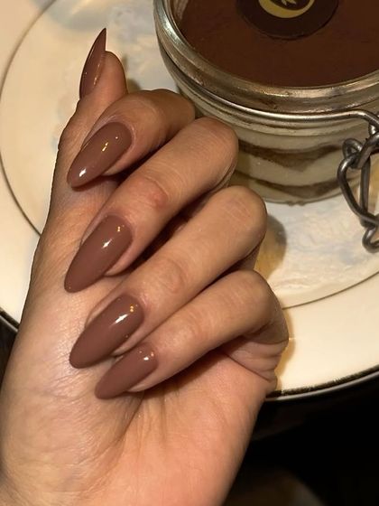 This moody, earthy brown is perfect for the autumn and winter seasons. It’s a sophisticated and warm shade that pairs beautifully with cozy sweaters.