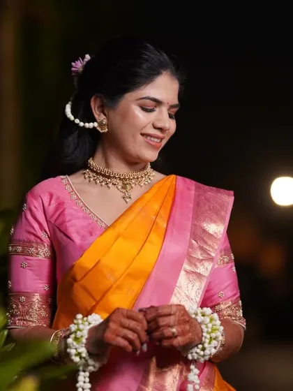 A beautiful candid portrait of the bride during her Haldi ceremony. The soft evening light and natural smile make for a perfect shot.