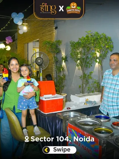 A mother and daughter proudly show off their colorful wax hand creation. It's a fun and creative souvenir from the party.