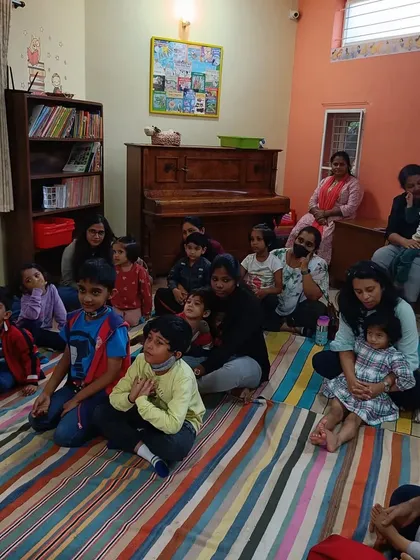 A room full of children and parents enjoying a story about music and adventure.