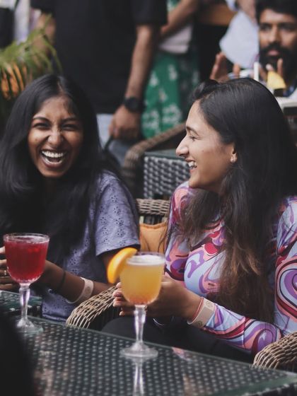 Laughing with friends over drinks and live Bollywood music. Can a weekend get any better than this?