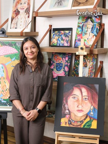 A student poses with her stunning watercolor portrait, showcasing the advanced techniques for skin tones and expression she learned in my course.