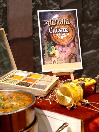 A display for our Awadhi Cuisine station, featuring a traditional spice box and a pot of rich curry, setting the stage for a royal feast.