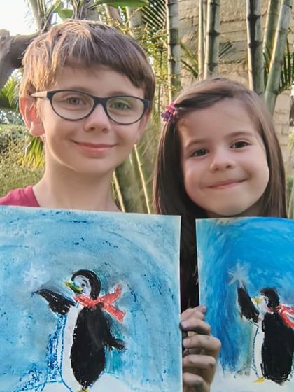 A close-up of two friends and their wonderful penguin creations.