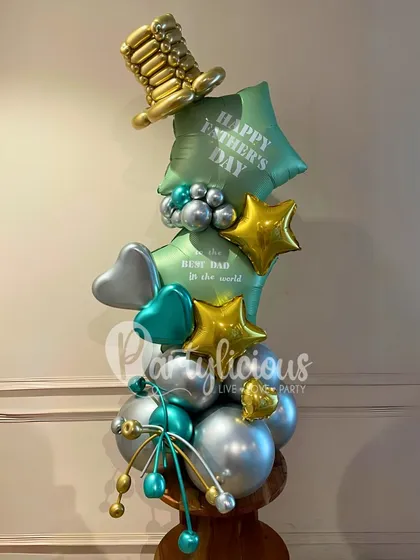 A dapper Father's Day bouquet for the best dad in the world. The combination of a golden top hat, star balloons, and a sophisticated green and silver color scheme makes this a standout gift.