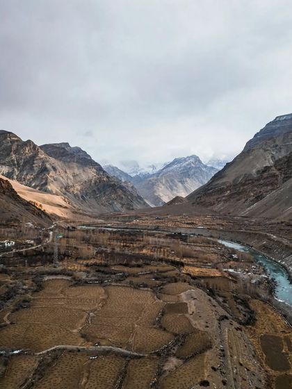 The barren, beautiful landscape of Poh village in Spiti, captured from a drone to show its remote setting.
