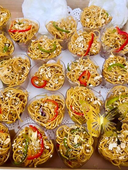 Mini Pepper Pot Noodle Shots are a perfect pass-around appetizer. Served in individual heart-shaped cups, they are easy to eat while mingling and offer a burst of Asian flavor.