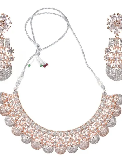 This beautiful rose-gold and silver dual-tone necklace set is perfect for receptions or cocktail parties. The design features floral studs and a choker adorned with American Diamonds.
