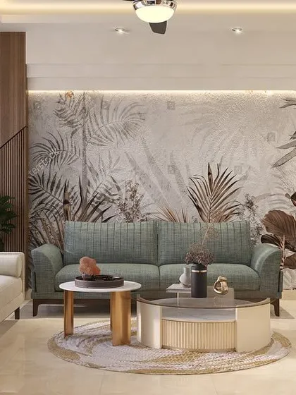 We designed this living room to feel calm and refreshing. The tropical-themed wallpaper serves as a beautiful backdrop, while the mix of sofa styles and a round coffee table creates a relaxed, eclectic vibe.