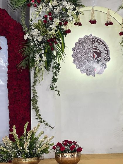 A closer look at the 'Mitakshi' centerpiece after installation. The combination of the intricate art, soft backlighting, and fresh flowers creates a stunning focal point.