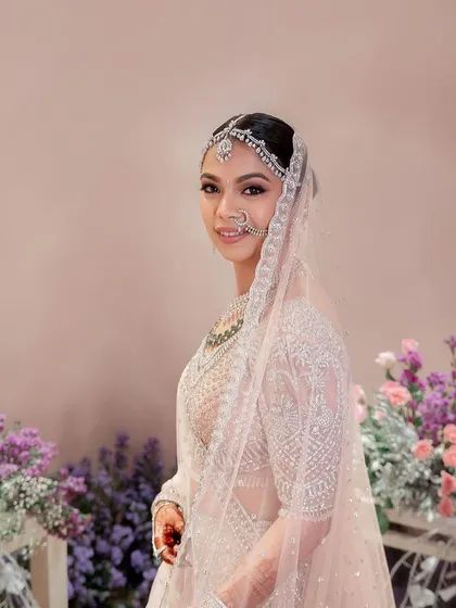 Hemangini looked ethereal in her pastel Falguni Shane Peacock lehenga. The makeup was kept soft and shimmery to match the intricate silver work on her outfit.