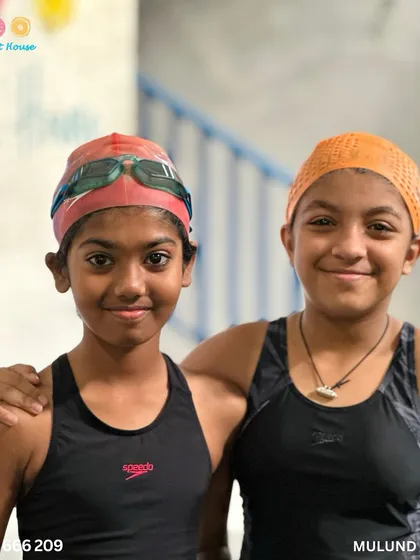 When friends swim together, they motivate each other. Two swim buddies share a smile during the competition.