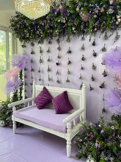 The complete Ruksati setup, featuring a wall of hanging flowers, a canopy of purple blooms, and a beautiful crystal chandelier. Every detail was designed to create a memorable and heartfelt farewell.