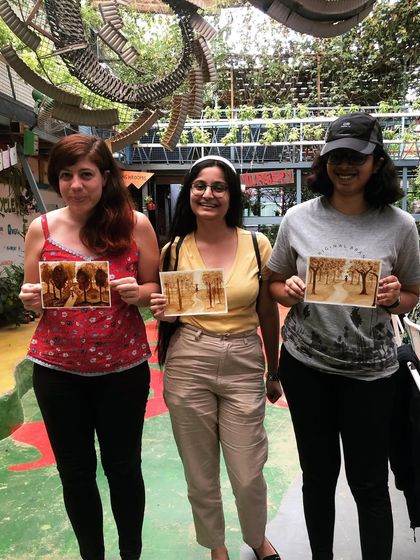 Three proud artists with their coffee paintings. It’s always a joy to see the variety of styles that emerge even when everyone is painting the same subject.