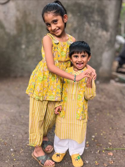Another happy moment captured in our yellow sibling set. The smiles say it all! These outfits are made for making memories.