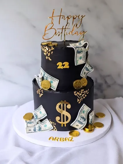 This two-tier money-themed cake is all about celebrating success. I used a bold black fondant as the canvas, decorated with edible dollar bills, gold coins, and a dollar sign. It's a striking and fun design, perfect for a milestone 22nd birthday.