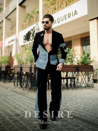 The full look of the black and denim fusion co-ord set, showcasing the flared trousers with their dramatic denim panels.