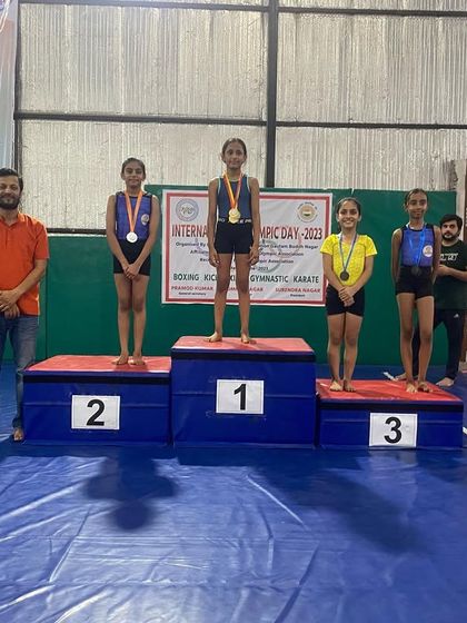 More winners from the World Olympic Day competition, proudly displaying their medals.