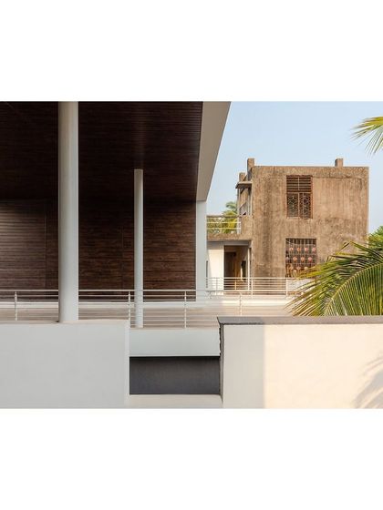 This view from the upper terrace of the "Solid | Void | Solid House" frames the neighboring building, showing how our design responds to its immediate context.