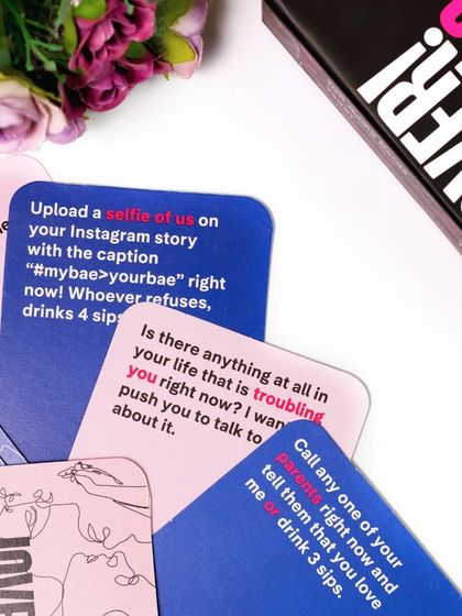 The last one in this series. A flatlay of a fun and daring couples' card game, styled with soft flowers to create a playful yet romantic feel.