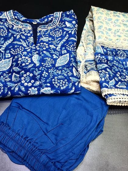 A classic indigo blue ready-made dress set in pure Chanderi. The traditional Jaipur block print and the delicate lacework on the dupatta make it a timeless and graceful choice.
