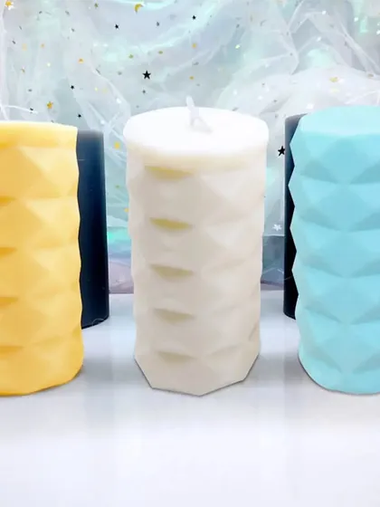 A selection of my diamond-cut pillar candles in yellow, white, and blue. You can mix and match colors to suit your personal style or event theme.