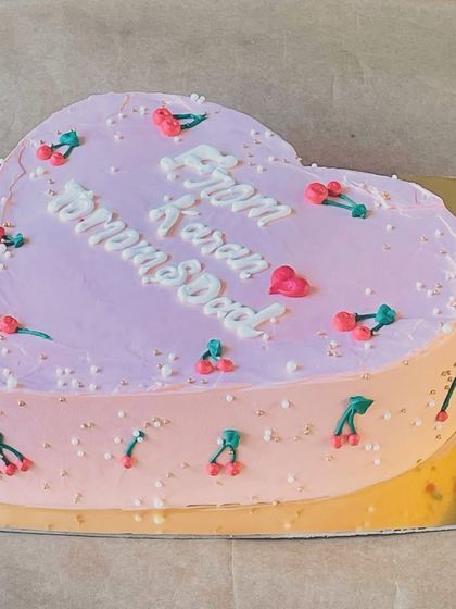 A vintage-inspired heart-shaped cake with delicate cherry details. This design offers a touch of nostalgia and sweetness.