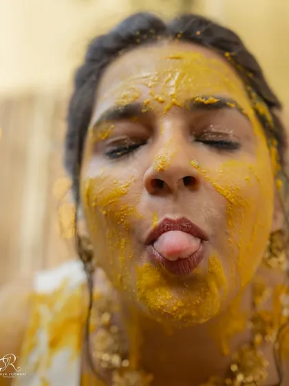 The bride having a bit of fun for the camera after being covered in haldi. I love when clients let their personalities shine.