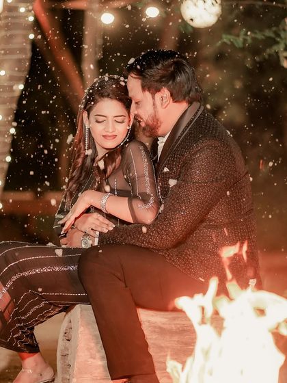 A romantic, snowy-effect pre-wedding photo. The makeup is soft yet defined, ensuring her features pop even in this dreamy, atmospheric shot.