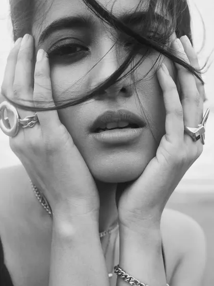A timeless black and white portrait from the beach shoot. The makeup translates beautifully, creating a dramatic and emotive image.