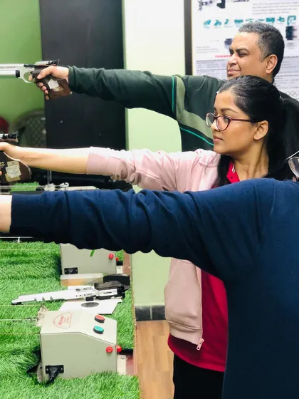 Shooting is a sport for all ages. Here, a family enjoys a session together, learning and practicing their aim side-by-side.