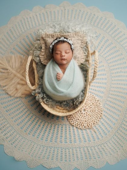 Another angle of this dreamy cloud setup. The intricate lace blanket and woven props add beautiful texture to this peaceful portrait.
