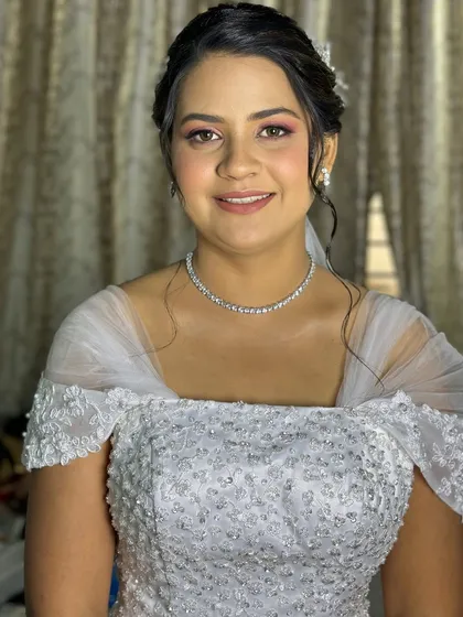 Bride Aldina looking stunning on her big day, with soft pink eyeshadow and a radiant complexion.