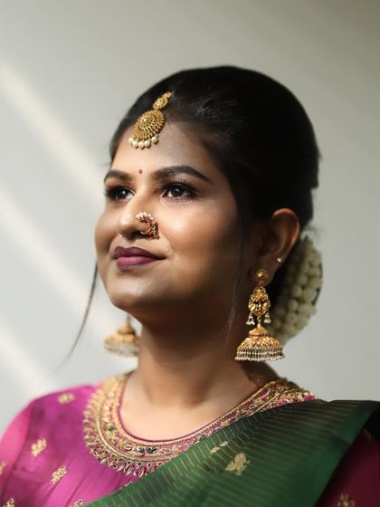 Six yards of pure elegance. Dr. Meghana for her pre-wedding ritual, looking stunning in a green and pink saree.