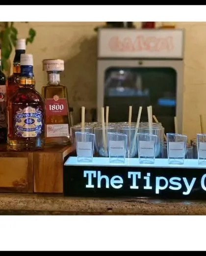 A clean and simple bar setup featuring premium spirits and our branded LED sign. This shows our ability to create an effective bar even in smaller spaces.