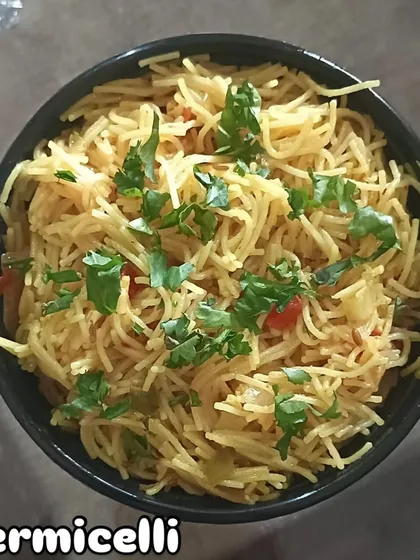 A bowl of my special vermicelli upma, garnished with fresh coriander. It's a quick and easy breakfast dish.