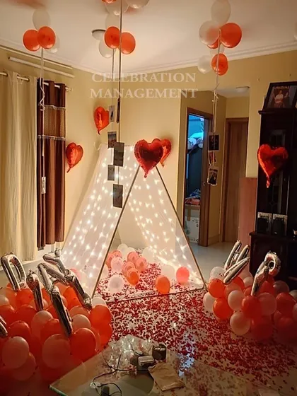 A different angle of the personalized canopy tent surprise. You can see the 'HAPPY BDAY' foil balloons and the heart-shaped balloons mixed in, all contributing to a very personal and heartfelt celebration.