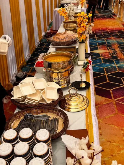 Our chaat stations are designed for efficient service. Here you can see the organized layout with serving bowls, spoons, and napkins ready for guests.
