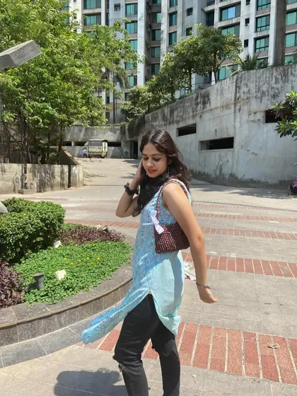 A customer looking amazing with her custom brown ribbon bag. It's a great everyday shoulder bag that's simple yet so pretty.