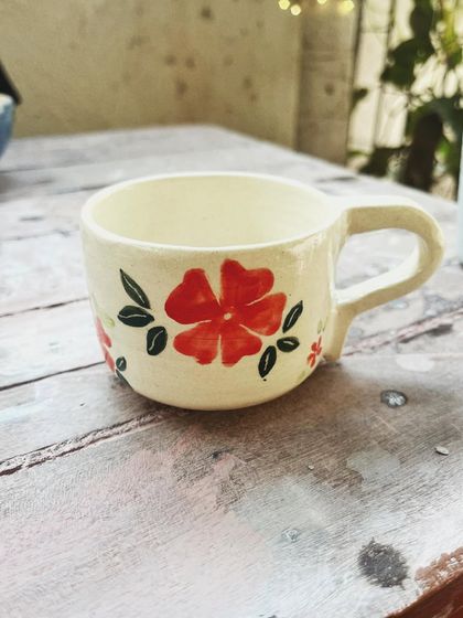 Look at the beautiful creations from this student who completed the intense potter's wheel course. Each piece is a masterpiece, adorned with colorful glazes and intricate, hand-painted details.