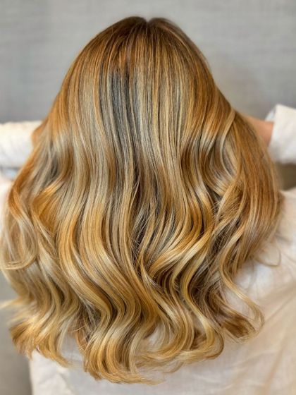 Another view of the pearl blond balayage, showing the beautiful blend of colors and healthy shine.