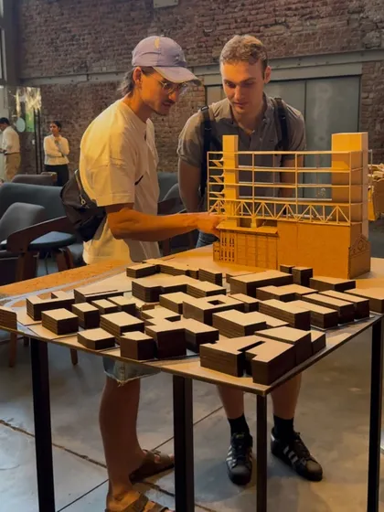 Students engaging with a large-scale model of one of our commercial projects. Physical models are a crucial tool for communicating complex spatial ideas, and it is rewarding to see them spark curiosity and conversation.