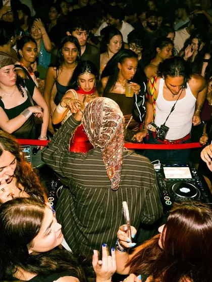 An overhead view of the DJ booth in NYC, completely surrounded by the crowd. This is how I like my parties, with everyone close and connected by the music.