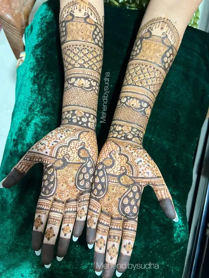 Another angle of the peacock design, showing the fine details and consistent application.
