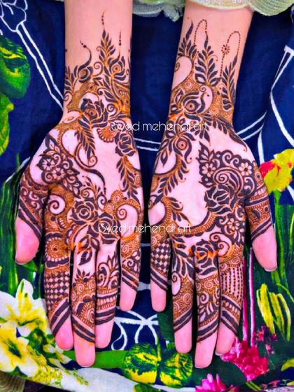 A beautiful party-wear design with a mix of florals and paisleys.