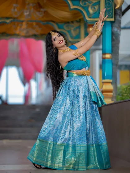 A full-length shot that captures the beautiful movement of the lehenga.