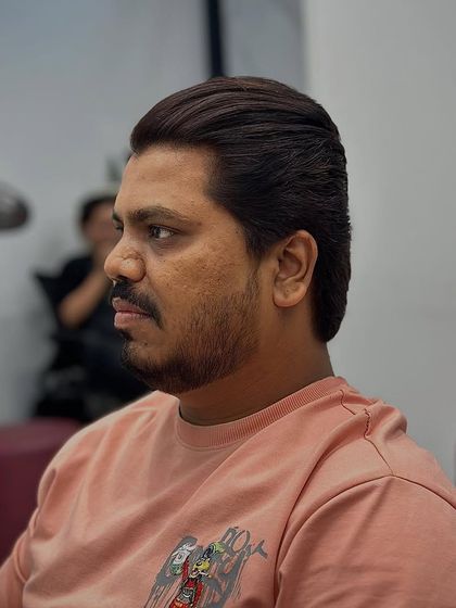 The side profile of this classic cut shows the clean lines and expert styling.