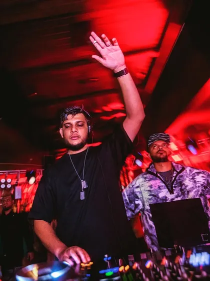 A motion-blur photo that captures the energy and movement of a live DJ set.