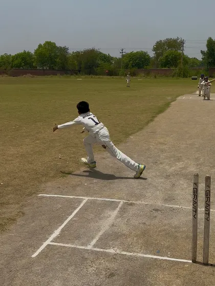 The bowler in his follow-through after delivering a wicket-taking ball.